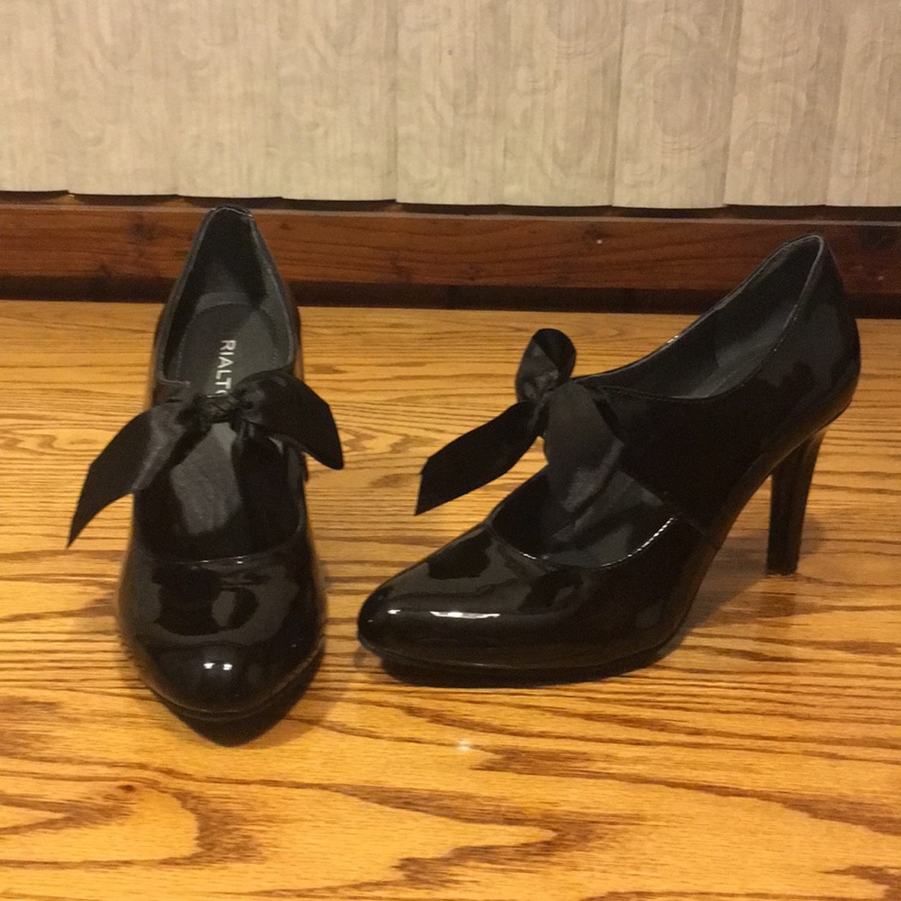 Rialto black patten leather shoes with bow detail